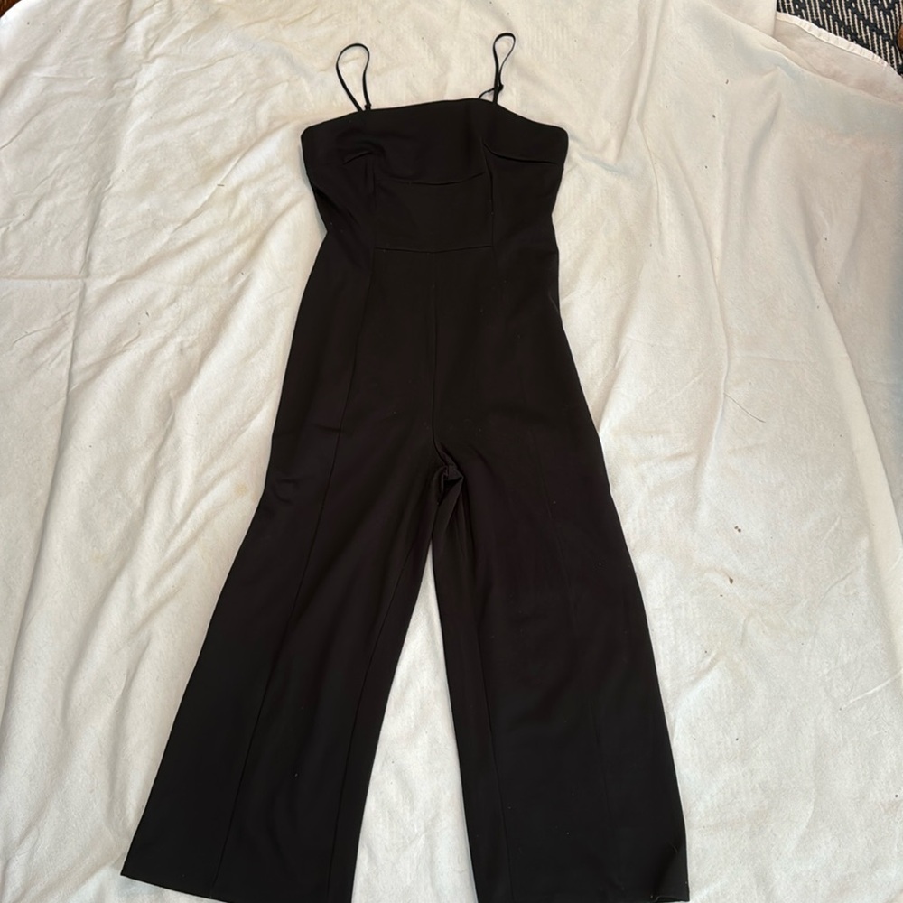 black pull on wide leg cropped stretch jumpsuit with adjustable straps